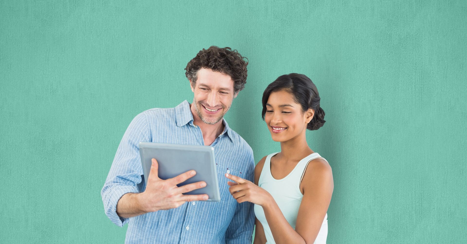 Digital composite of Business people using digital tablet over green background